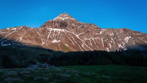 Timelapse-View-Of-Sunset-Light-Creating-Shadow-On-Pizzo-Scalino-Mountain