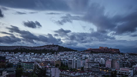 Timelapse-shot-of-cloud-movement-over-city-surrounding-Acropolis-of-Athens-in-Greece-on-a-cloudy-evening