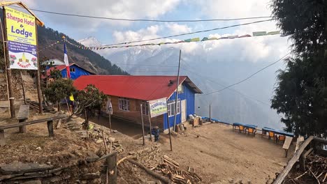 Hiker-with-big-backpack-arriving-a-Sherpa-hotel-in-Chandanbari-on-langtang-and-gosaikunda-Trek-of-Nepal