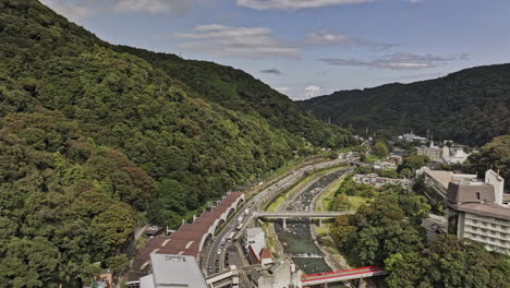 Hakone-Japan-Aerial-v2-drone-flyover-Yumoto-train-station-along-Haya-river-capturing-the-popular-Japanese-hot-springs-resort-town-nestled-in-the-mountains---Shot-with-Mavic-3-Pro-Cine---October-2023