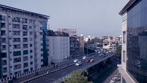 Flyover-bridge-traffic-surrounded-by-buildings-view-at-Vadodara,-Gujarat,-India---Full-HD