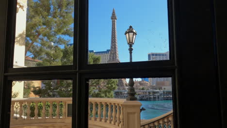 Walking-in-Interior-of-Bellagio-Casino-Hotel-to-Terrace-Door-With-View-of-Las-Vegas-Strip-on-Sunny-Day