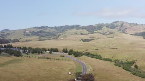 Aerial-rising-dolly-shot-of-Hearst-Castle-perched-at-the-top-of-the-hills-above-San-Simeon,-California