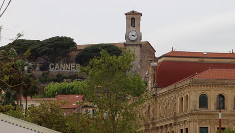 Historic-buildings-and-lush-greenery-in-Cannes-surround-clock-tower