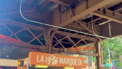 Wide-Tilt-Down-Shot-of-La-Marqueta-in-Harlem-New-York-City