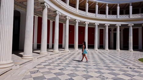 Beautiful-young-woman-in-a-classic,-Greek-atrium-with-marble-columns