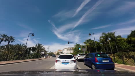 Blue-sky-and-city-of-Estepona-from-moving-car-POV,-hyper-lapse