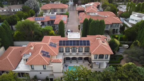 Drone-Aerial-View-of-Solar-Panels-on-Modern-Eco-friendly-Home