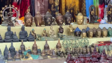 Buddha-souvenirs-in-Borobudur-temple-kiosk,-motion-view