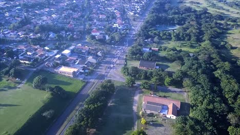 Drone-flying-over-some-colourful-residential-houses-with-a-slight-sea-view-in-the-distance-on-the-Bluff-in-Durban-south-Africa