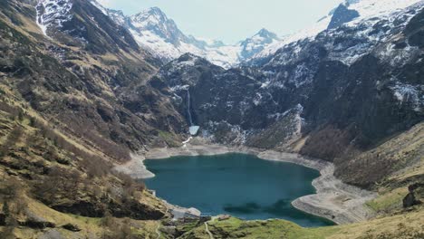 Mountain-Lake-and-Water-Reservoir-Lac-d'Oo-in-French-Pyrenees,-France---Aerial-4k