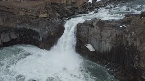 Static-aerial-of-flowing-waterfall-named-Aldeyjarfoss-in-Iceland