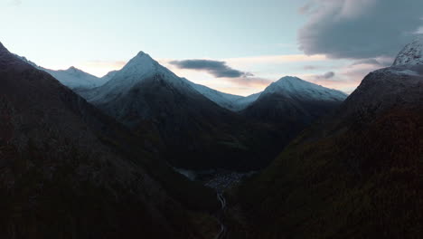 Sunset-sunrise-Saas-Fee-Saastal-Switzerland-aerial-drone-bridge-gondola-Metro-Alpin-tram-Swiss-Alpine-Alps-chalet-valley-mountains-morning-golden-hour-glacier-Feevispa-circle-right