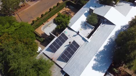 Drone-Aerial-View-of-Solar-Panels-on-Modern-Eco-friendly-Home