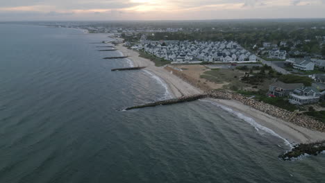 Aerial-establishing-shot-of-residential-houses-on-beach-of-Nantucket-Island,-USA