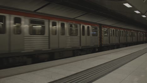 Athens-metro-train-arriving-at-a-modern-subway-station-platform,-showcasing-the-sleek-design-and-efficient-layout-of-urban-transit-systems