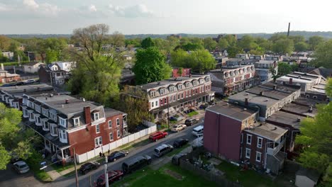 Aerial-approaching-shot-of-american-town-with-houses-and-parking-cars-on-street