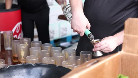 Capture-the-iconic-moment-of-Kentucky-Derby-Mint-Juleps-being-expertly-poured,-adding-to-the-festivities-of-the-150th-event