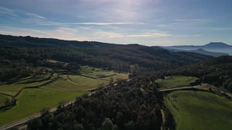 The-scenic-tavertet-region-in-barcelona-with-lush-green-landscapes-and-mountains,-aerial-view