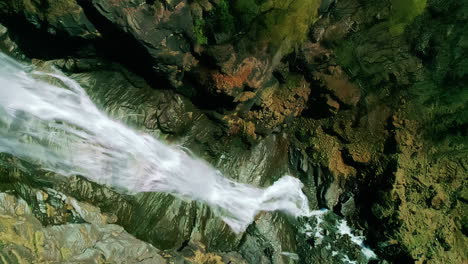 Depth-view-of-the-Naeroyfjord-waterfall-in-Aurland,-Norway