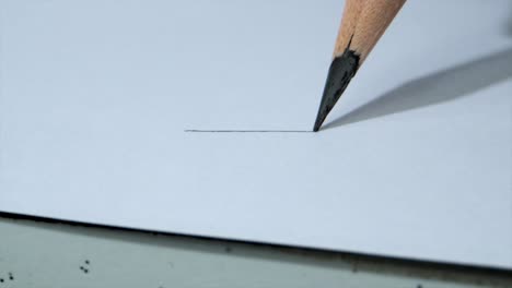 Drawing-line-with-pencil-with-tight-force-closeup