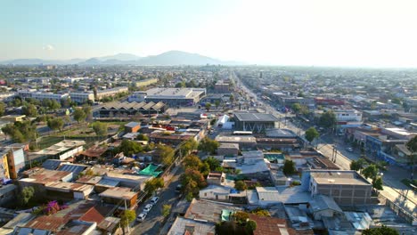 Aerial-Drone-Fly-Low-neighborhood-of-Santiago-de-Chile-Lo-Prado-in-clear-skyline