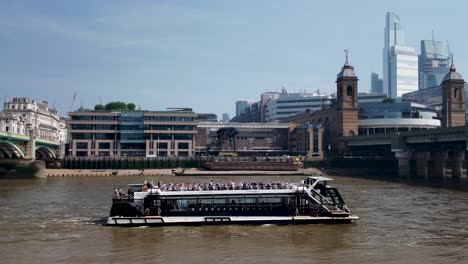 River-Boat-Cruising-On-River-Thames,-Passing-Through-Arch-Of-Southwark-Bridge-In-London,-UK