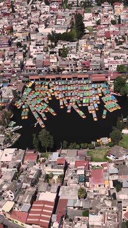 Aerial-view-of-ferry-dock-in-Xochimilco,-Mexico-City,-vertical-mode