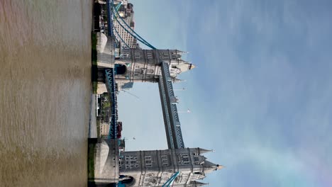 Vertical-Shot-Of-Iconic-Tower-Bridge-Of-London-Crossing-River-Thames-On-Sunny-Day-In-UK