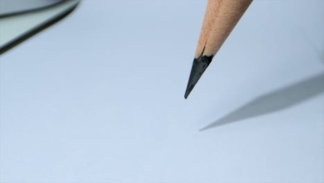 Drawing-line-with-pencil-with-tight-force-closeup