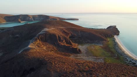 Desert-hills-and-shoreline-in-Baja-California-Sur,-during-golden-hour