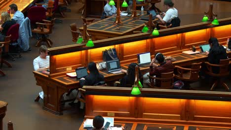 People-studying-and-learning-within-the-grand-majestic-La-Trobe-Reading-Room-at-the-State-Library-Victoria,-Melbourne-central-business-district,-concept-shot-of-Australian-students-HECS-debt