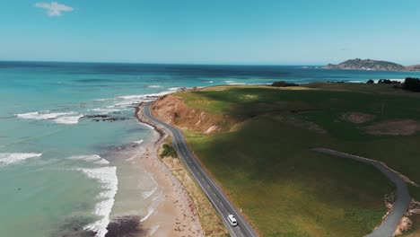 Van-driving-on-coastal-road-at-Molyneux-Bay-near-Kaka-Point-in-Otago-Region-of-New-Zealand