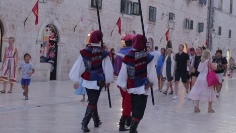 Soldiers-in-traditional-Croatian-clothes-marching-on-the-streets-of-old-town-Dubrovnik,-Croatia