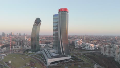 Aerial-View-Of-Three-skyscrapers-of-CityLife-district-called-"Tre-Torri"-In-Milan-During-Golden-Hour