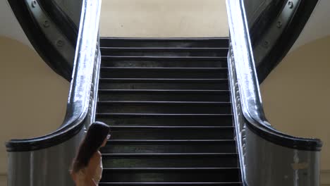 Staircase-inside-the-historic-Gia-Long-Palace-in-Ho-Chi-Minh-City,-Vietnam,-woman-walking-up