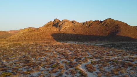 Desert-landscape-during-golden-hour-with-hills-in-the-background,-baja-california-sur