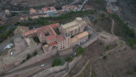 The-historic-cardona-castle-overlooking-the-surrounding-town-and-landscape,-aerial-view