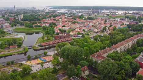 Water-canals-and-cityscape-of-Klaipeda,-aerial-drone-view