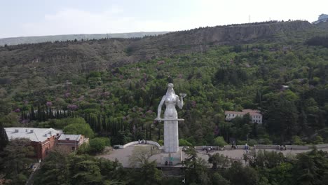 Aerial-shot-of-Mother-of-Georgia-Tbilisi-Georgia-city-center-peace-bridge-Samiba-church-river-old-houses