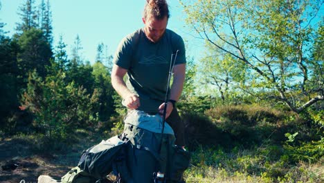 Caucasian-Man-With-Beard-During-Mountain-Camping-Hike-In-Summertime