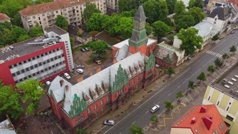 Church-tower-and-downtown-of-Klaipeda-city,-aerial-drone-view