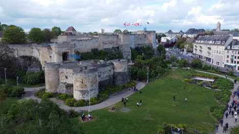 Aerial-Dolly-In-to-Caen-City-Castle-en-People-in-the-Park---Sunny-Day