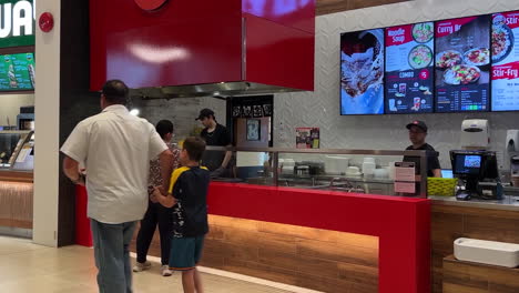 Motion-of-people-buying-a-meal-at-the-food-court-inside-Coquitlam-shopping-mall-with-4k-resolution