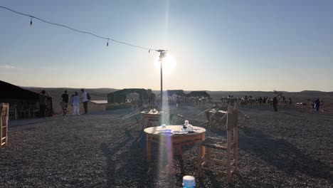 Bedouin-camp,-sunset-in-Agafay-desert-outside-Marrakesh,-Morocco-day-trip