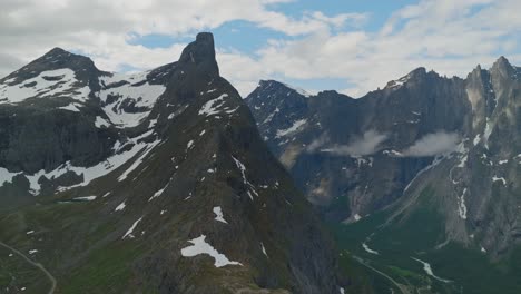 Scenic-mountain-landscape-of-Mount-Litlefjellet-and-Trollveggen-in-Romsdalen-Valley-Norway,-aerial