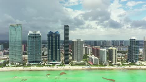 Drone-shot-skyscrapers-buildings-at-Sunny-Isles-Beach-Miami-City,-South-Florida,-USA-ariel-view-4k