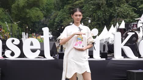 An-Indonesian-fashion-model-is-showing-off-a-product-outside