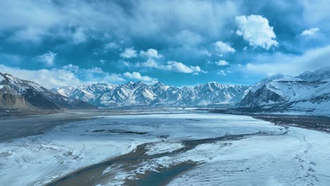 Wide-angle-view-of-snow-covered-range-of-mountains-at-Skardu-during-daytime-in-Pakistan