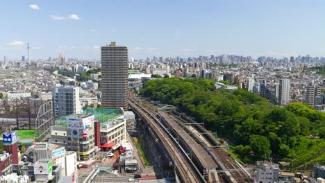 Beautiful-high-above-panorama-view-over-Tokyo-with-train-tracks